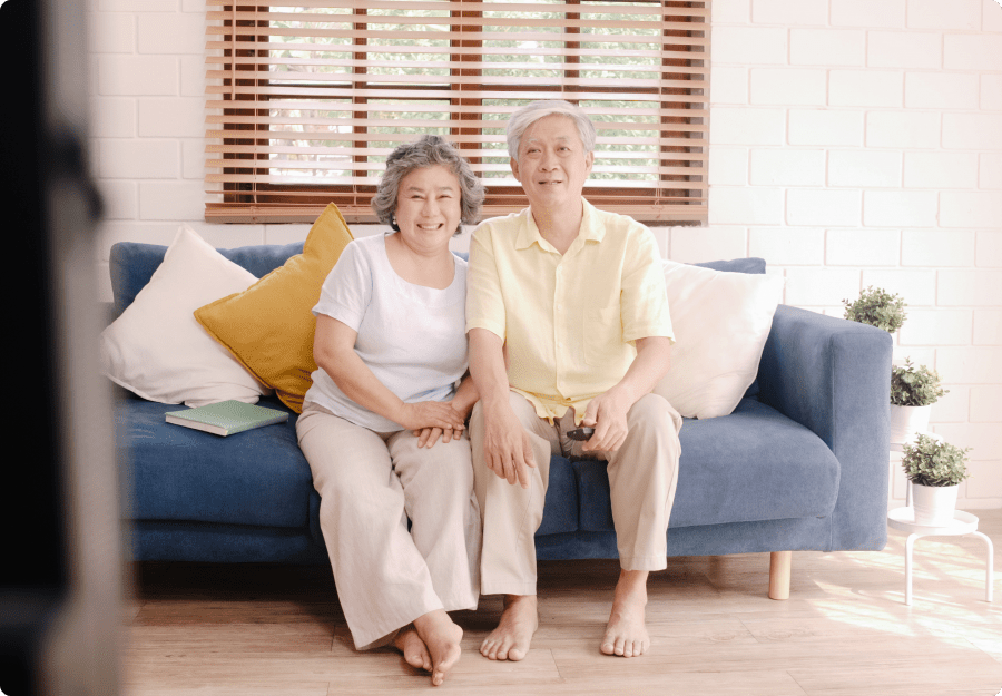 elderly couple watching simple tv