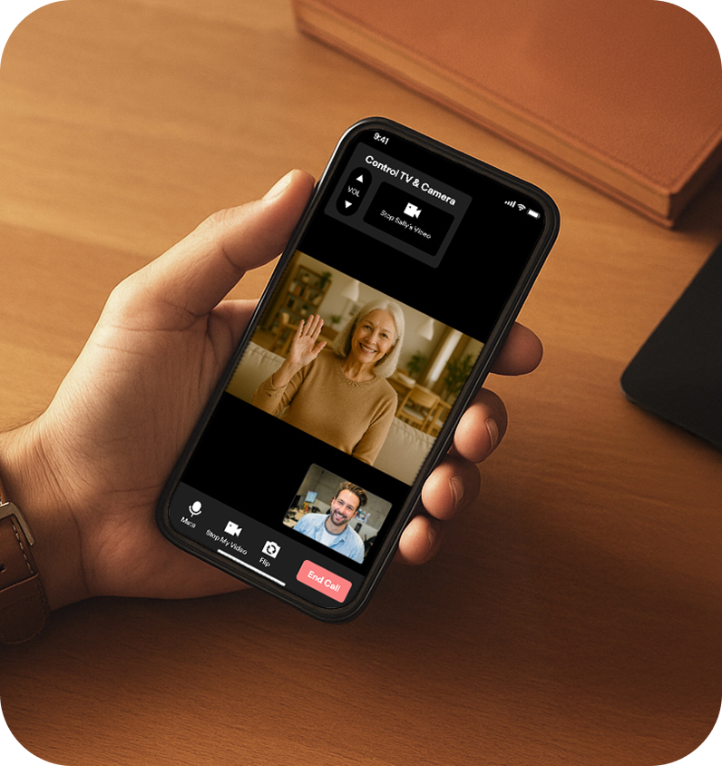 Hand holding a smartphone with a video call active on the JubileeTV app showing how much of the room is visible on the call.