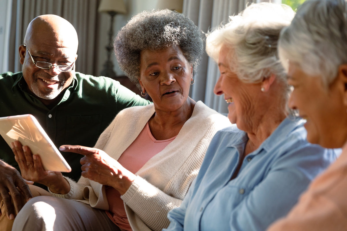 Seniors communicating with tablet