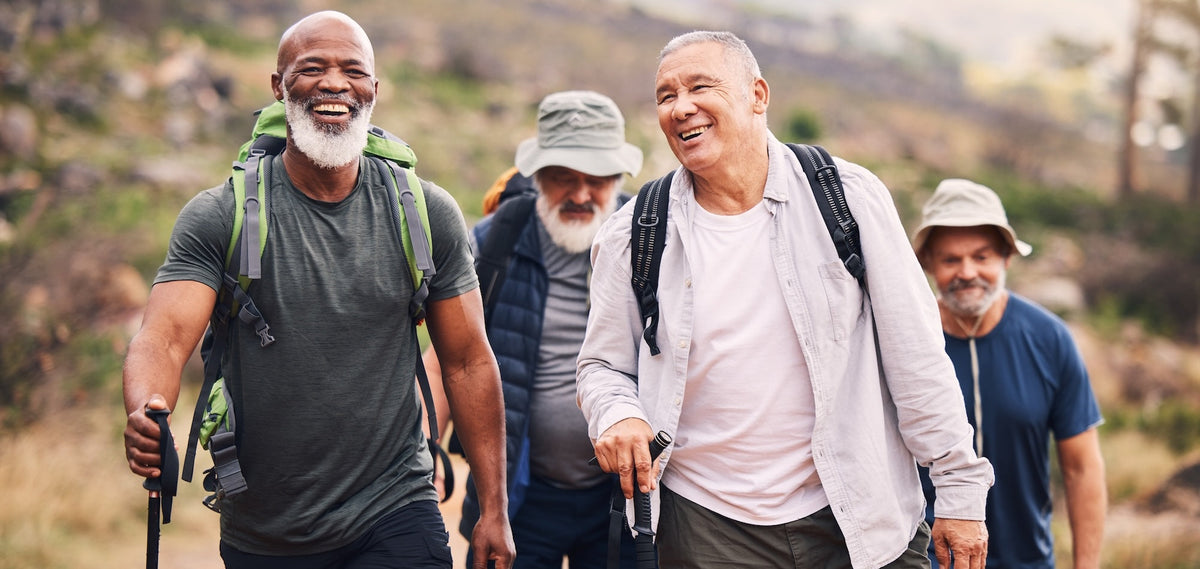 4 Senior men out connecting on a hike together