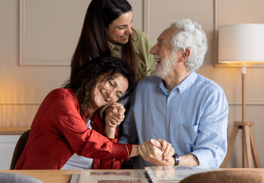 adult daughter supporting elderly father