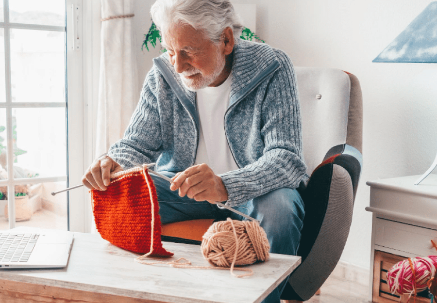 elderly man social activity knitting