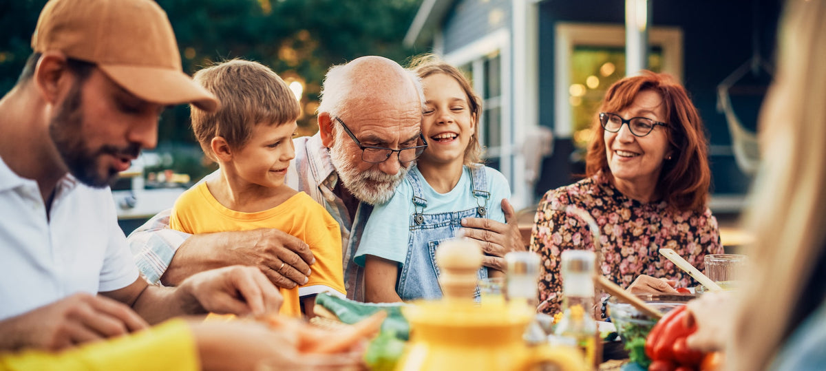 Family celebrating senior citizen's day with elderly parent