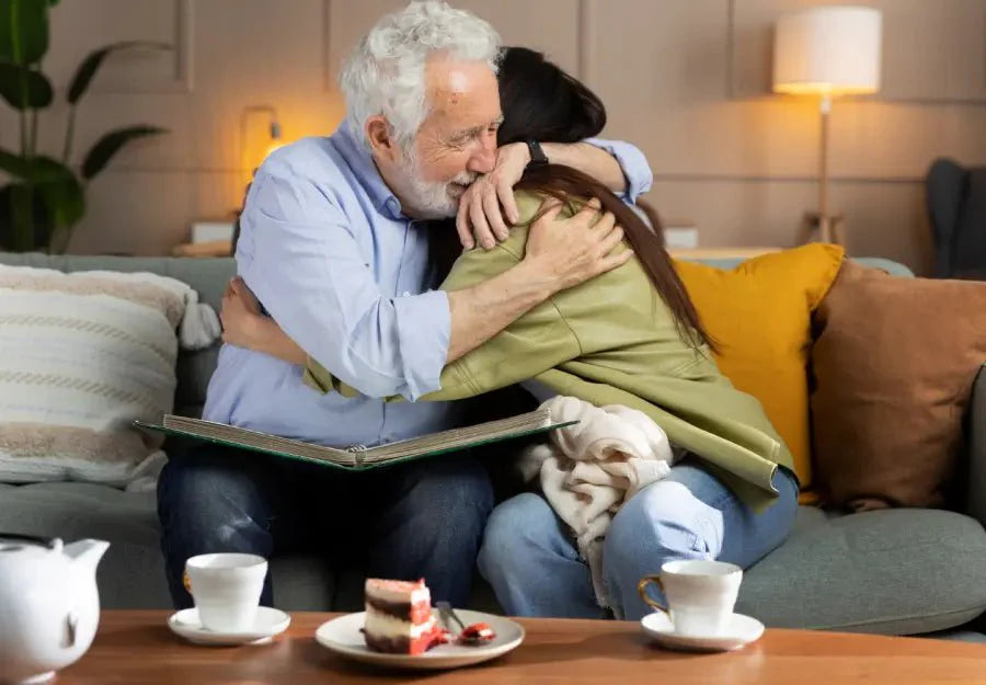 Elderly man hugging his daughter finding joy through connection