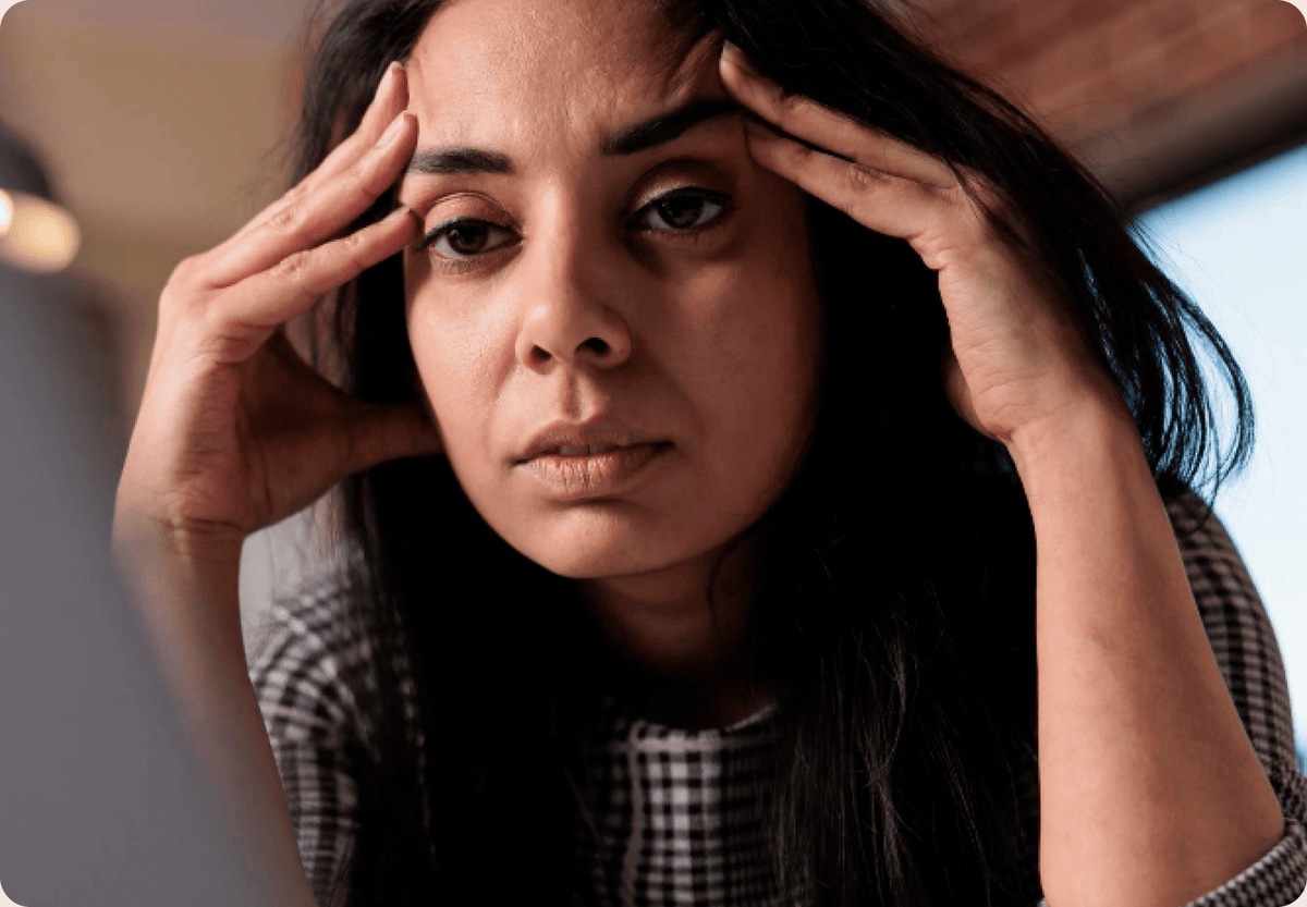 A stressed caregiver is feeling strain of remote caregiving