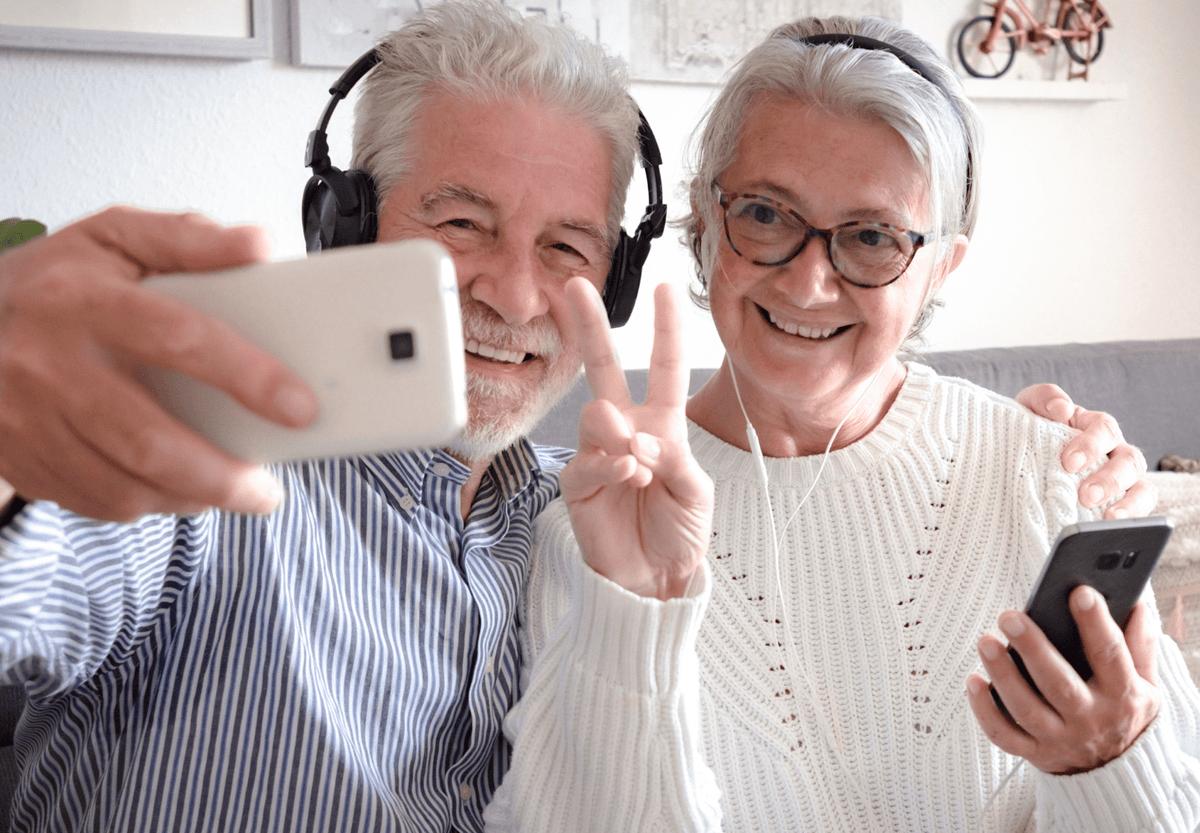 An elderly couple video calling on s smartphone