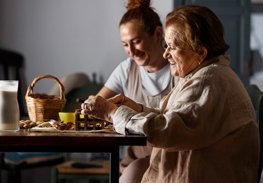 an elderly woman is spending time with her granddaughter during national caregivrer month