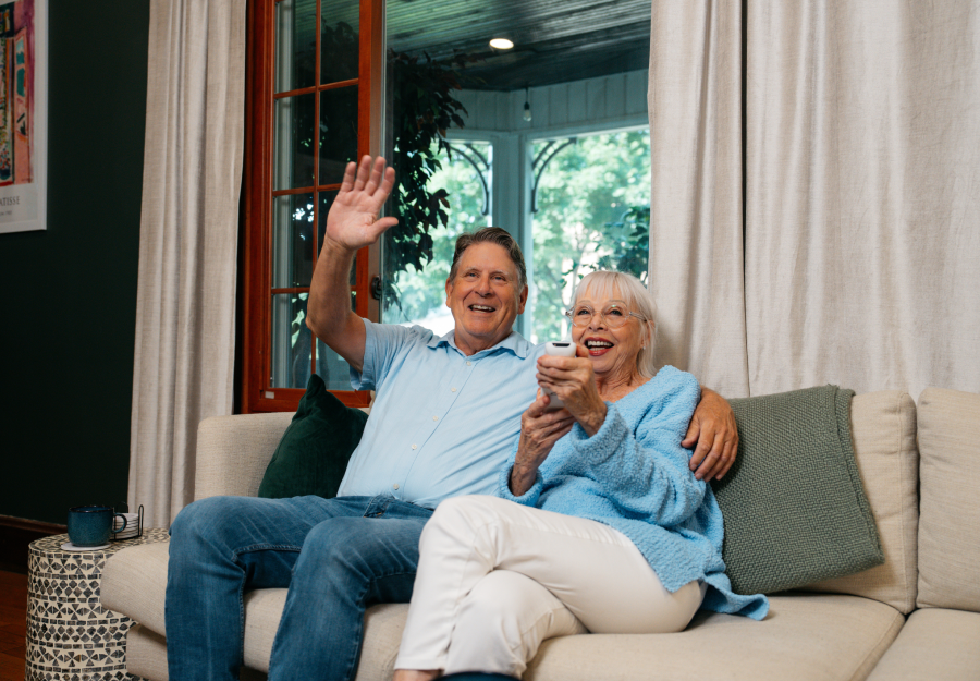 elderly woman video calling on TV