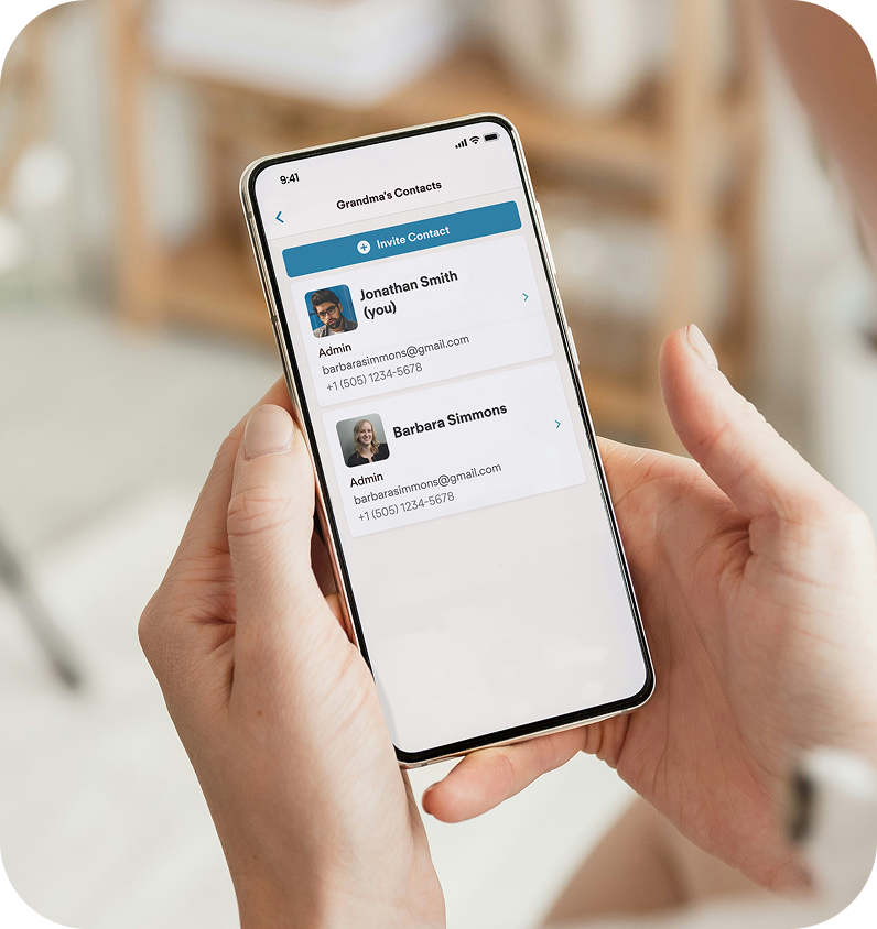 Person holding a smartphone displaying a contact list with names and emails.  Once you click on the individual you can control their permissions within the JubileeTV app as the administrator.