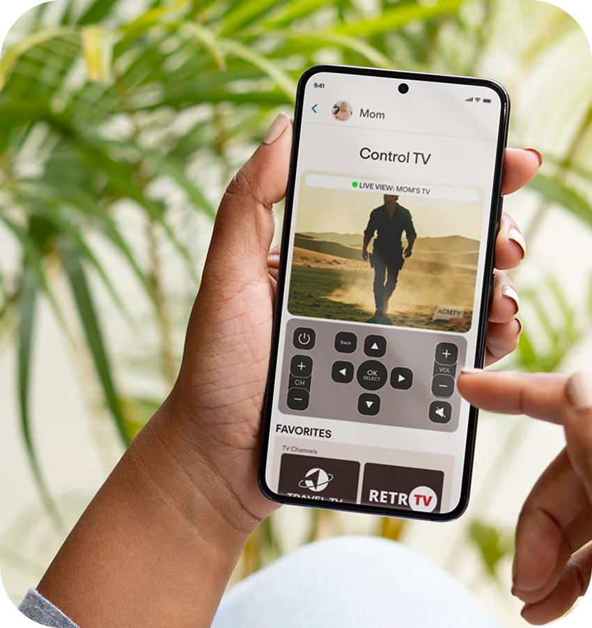 Adult daughter controlling elderly mother's television remotely from JubileeTV app