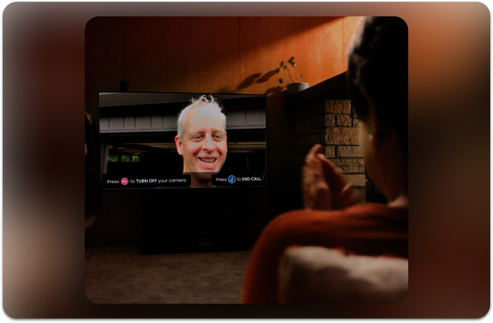 elderly woman on a video call on her tv